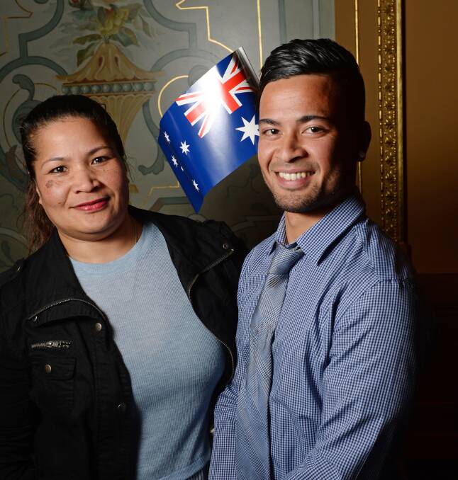 PROUD: Clarencia Charky and Berio Clarence were two of the 54 people who became new Australian citizens in a ceremony at Bendigo Town Hall on Monday night. Picture: DARREN HOWE