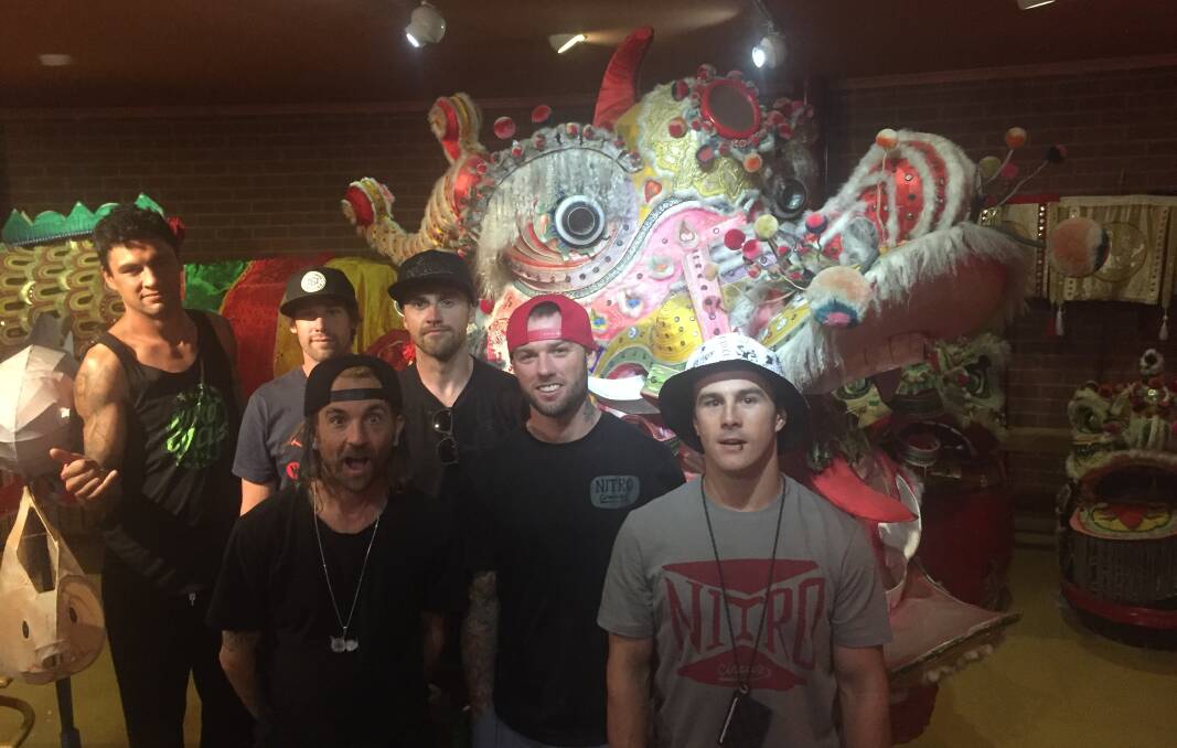 VISITORS: Nitro Circus riders played tourist with Sun Loong on Friday.