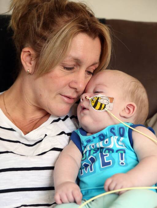 FAMILY: Joanne Carmichael with her son Tye. Tye suffers from Lissencephaly, a rare brain disorder, as well as seizures and an optic nerve disorder. Picture: GLENN DANIELS