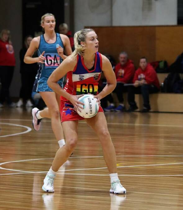City West Falcons' Zoe Davies and Boroondara Express' Ruby Barkmeyer (background) share the court during the 2022 VNL season. Picture by Robbab Photography