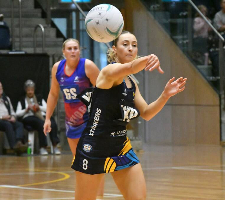 Milly Wicks sends the Strikers into attack against the Western Warriors. Picture by Adam Bourke