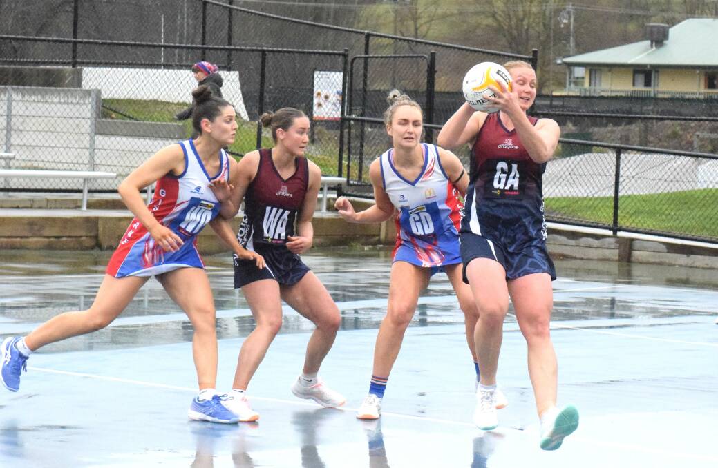 Dual Betty Thompson medallists duel. Heather Oliver takes possession for Sandhurst despite pressure from Gisborne's Maddy Stewart. Picture by Kieran Iles