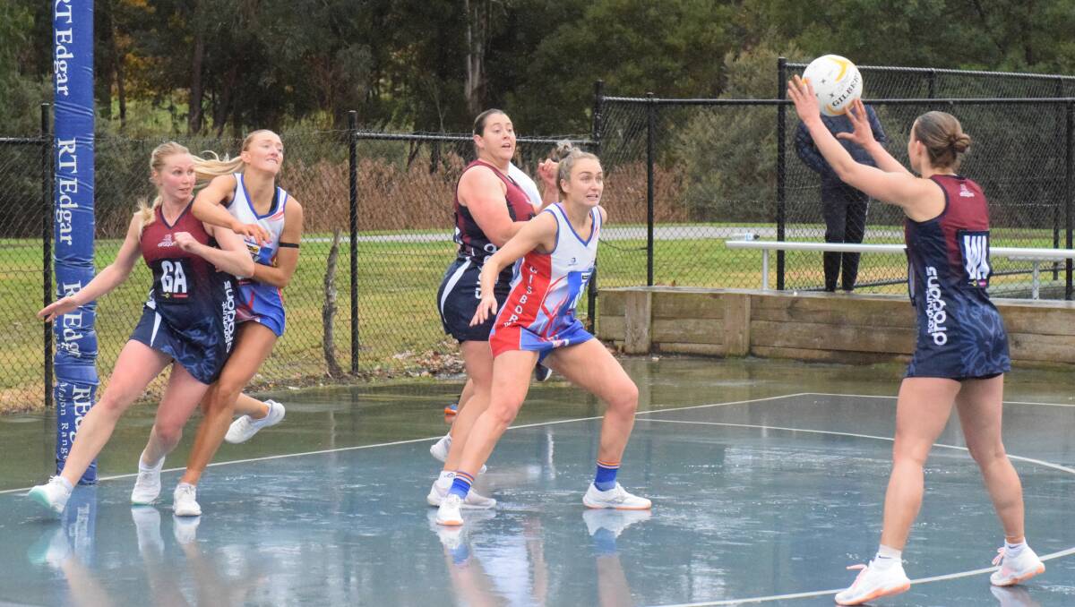 The smothering defence of Gisborne's Charlee Kemp and Maddy Stewart helped the Bulldogs curtail fierce rivals Sandhurst at Gardiner Reserve on Saturday. The Bulldogs won their round 11 battle 42-31. Picture by Kieran Iles