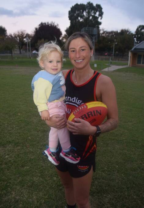 Shae Murphy, with her 18-month old daughter Blaire, played her 200th game of female football in Bendigo Thunder's CVFL Women's match against Woorinen last Sunday. Picture by Kieran Iles
