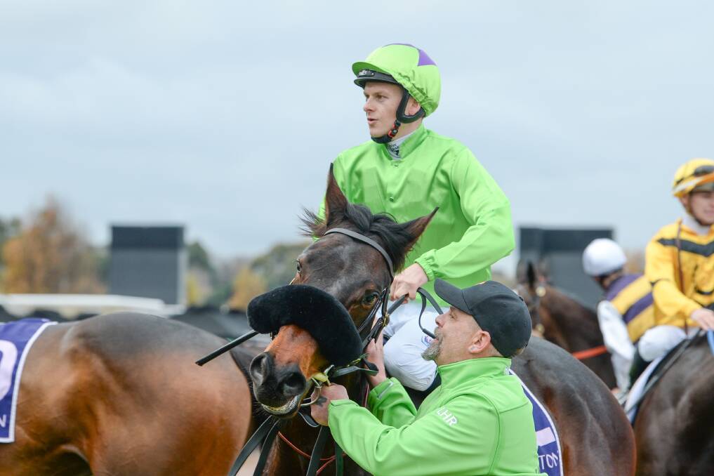 Ethan Brown returns to scale on Virtuous Circle after winning at Flemington on Saturday. Picture by Ross Holburt/Racing Photos