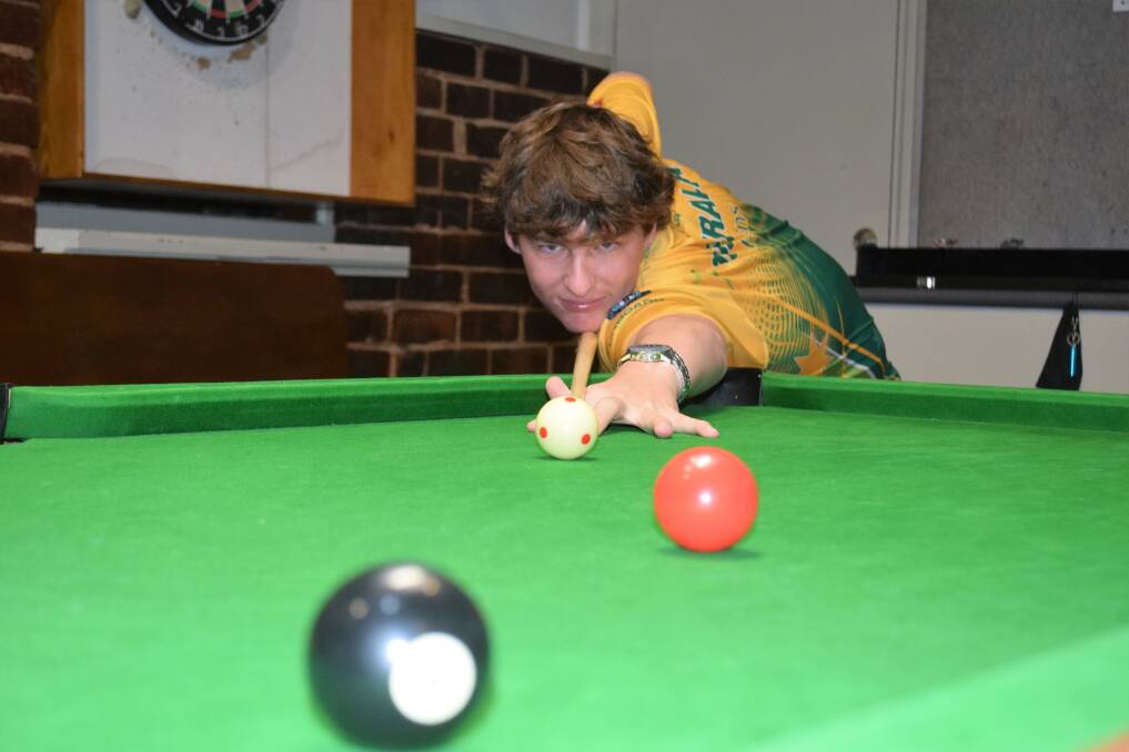 Joseph Evans, pictured at the Camp Hotel in Eaglehawk where he plays on Monday nights, shows the style that netted him his first world doubles championship last month. Picture by Kieran Iles