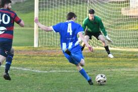 Strathdale midfielder Keian Tramm fires at goal in the Blues' 3-2 win over Epsom on Saturday evening. Picture by Adam Bourke
