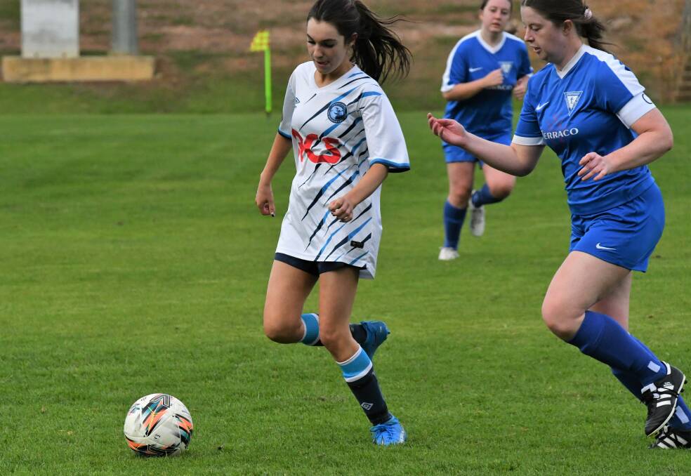 FC Eaglehawk's Emma Pengelly leads the race for the ball in the League Cup clash with Strathdale at Beischer Park. Picture by Adam Bourke