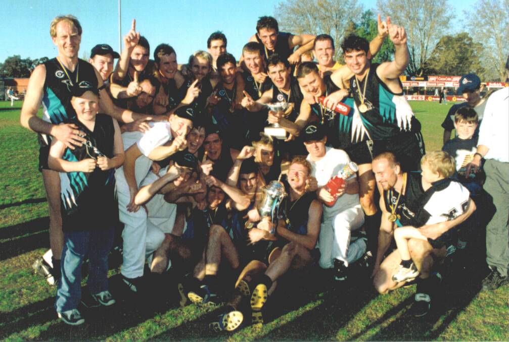 Maryborough players celebrate the 1998 Bendigo Football Netball League grand final victory.