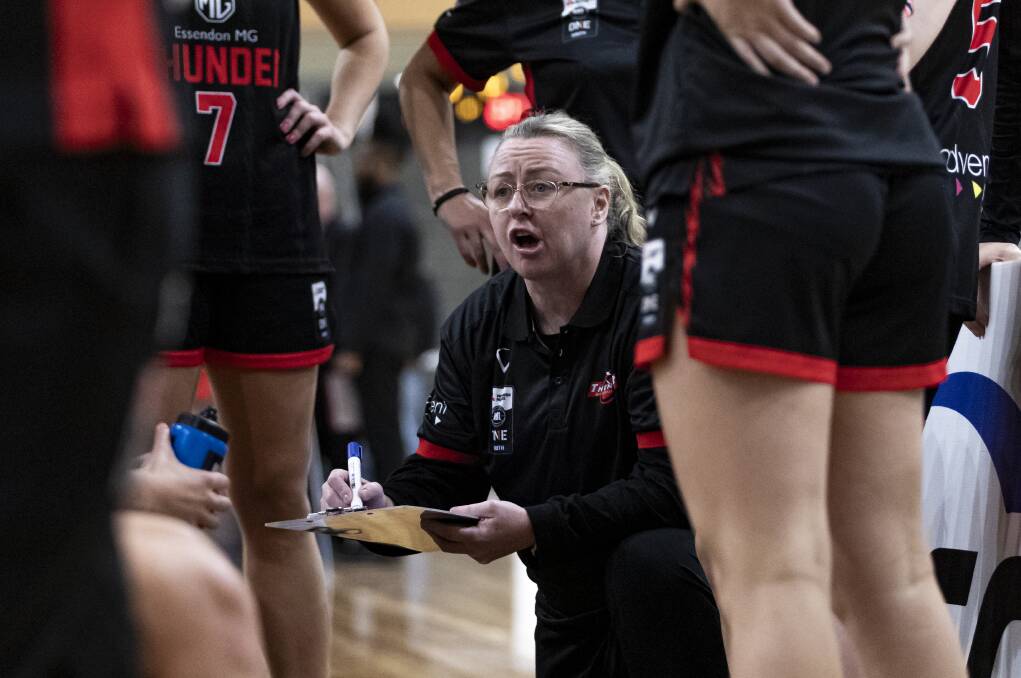 Kristi Harrower gives instructions to Keilor Thunder players. Picture by @Trent_Moore_Sports_Photography
