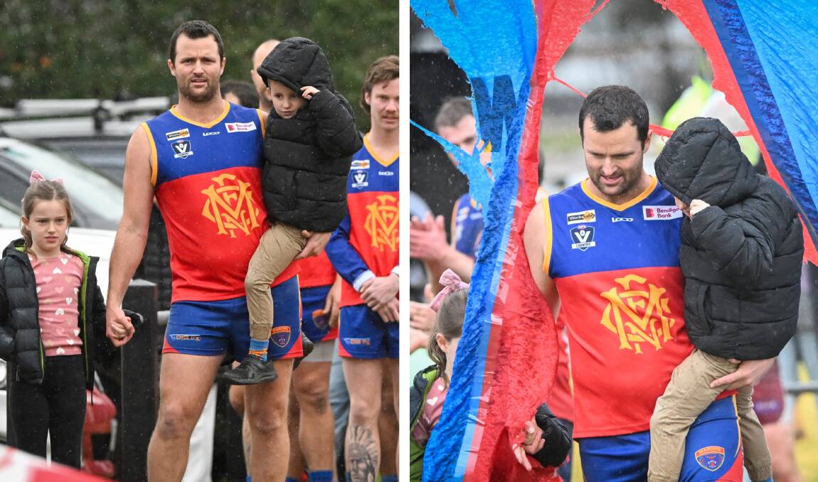 Kain Robins and his children Eden and Jimmy lead Marong onto the ground for his 450th senior game on Saturday. Pictures by Darren Howe
