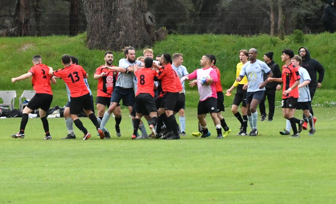 Shepparton SC and Swan Hill players come together in the dying minutes of Sunday's League Two Men preliminary final. Pictures by Luke West