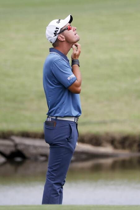 GREAT FORM: Lucas Herbert ponders an approach shot on day one of the Australian PGA Championships on the Gold Coast. Picture: FAIRFAX MEDIA