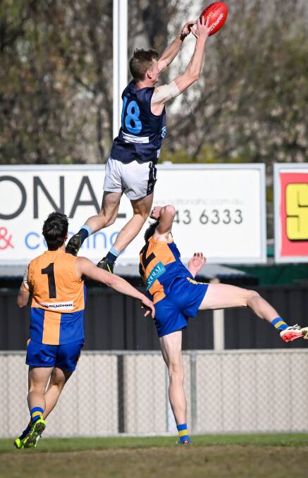 Eaglehawk's Brady Rowles soars in an attempt to mark against Golden Square on Saturday. Picture by Darren Howe