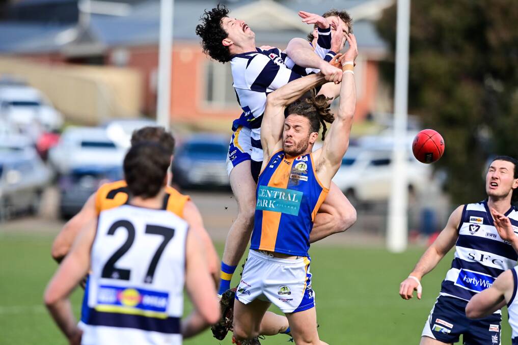 Strathfieldsaye's Jake Hall tries to mark over the top of Jack Geary. Picture: BRENDAN McCARTHY