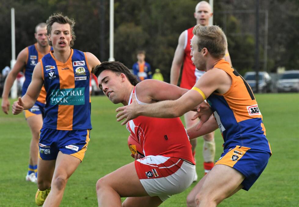 South's Cooper Leon tries to break a tackle. Picture by Adam Bourke