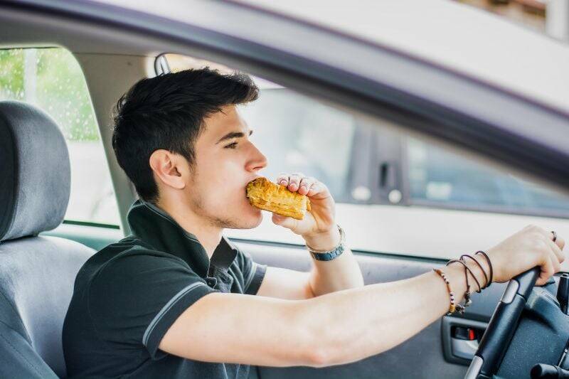 Is it legal to eat while driving in Australia?