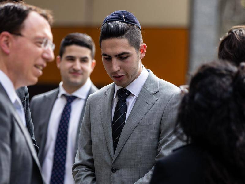 Joel Kaplan (centre) is one of the students who'll get an in-person apology from a senior official. (Diego Fedele/AAP PHOTOS)