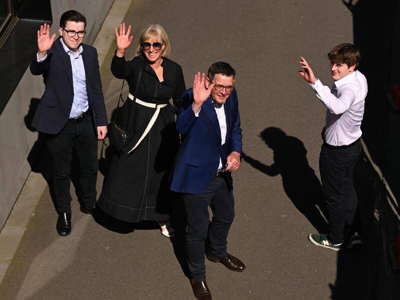 Daniel Andrews announced his resignation as premier with his wife Cath and their sons beside him. (James Ross/AAP PHOTOS)
