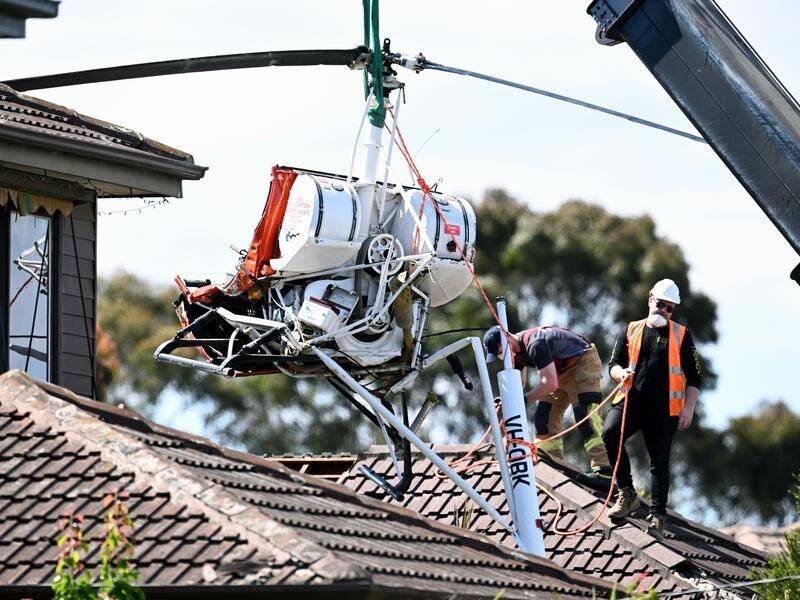 A student pilot is in hospital after his helicopter crashed into the roof of a Melbourne home. (Joel Carrett/AAP PHOTOS)