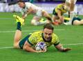 Australia's Corey Toole scores a try against the United States during their quarter-final clash. Photo: Iain McGregor/AAP PHOTOS