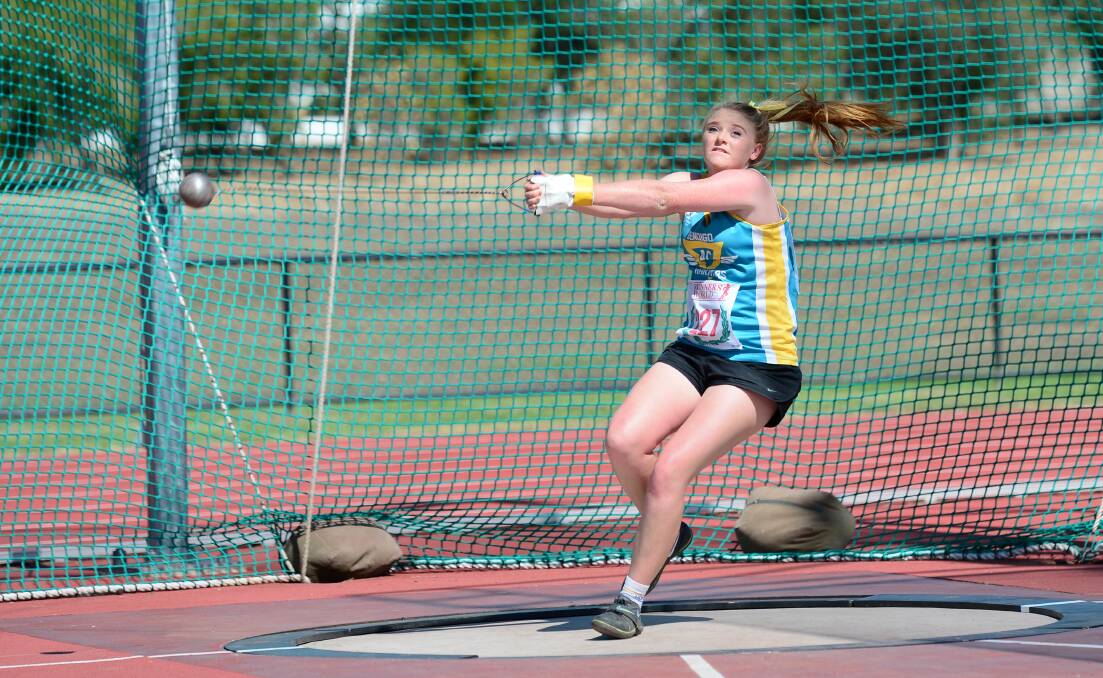 Karly Mitchell competes in hammer throw at an Athletics Bendigo track and field meet in Flora Hill. 
