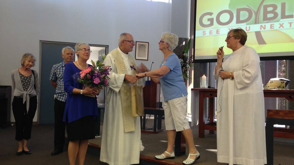 THANK YOU: Roger and Regina Rich pictured receiving thank you gifts at their final service at St Mary’s, Kangaroo Flat.
