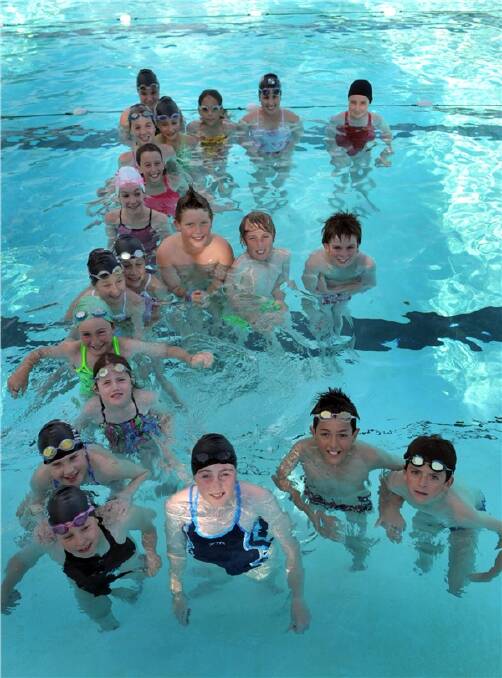 GIVE ME AN E: Junior members of the Bendigo East swimming club. Picture: NICK McGRATH